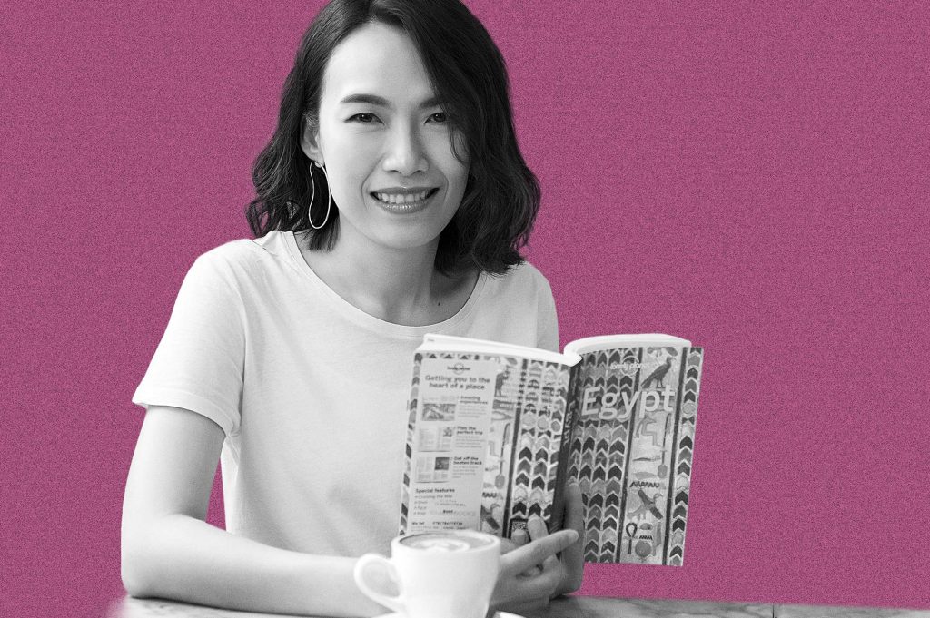 Fon Apasorn Methapipatanakul of Brand New Day Asia holding a travel book